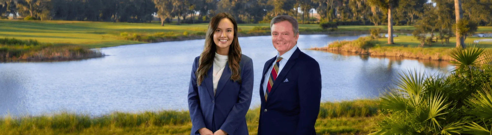 Two lawyers next to a lake.